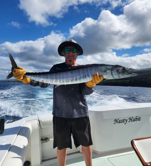 Hawaii deep sea fishing—wahoo strikes!