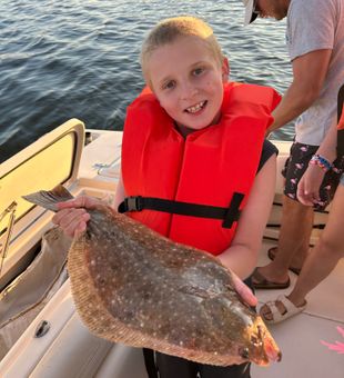 Young angler proud with a big Flounder catch!