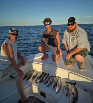 Successful Gulf Coast fishing trip with a great catch of Redfish