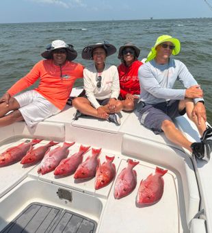 Excellent Red Snapper catch on a family fishing charter with Sea Dawg Charter