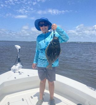 Solid flounder catch on a calm bay day