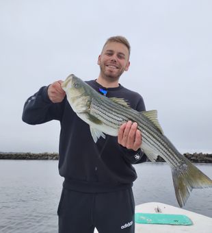 Big smiles and bigger stripers from today’s trip.