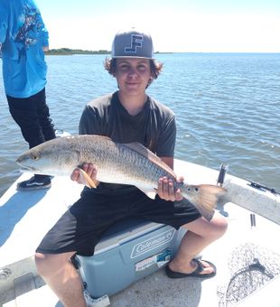 Solid Redfish catch on a sunny Texas bay!