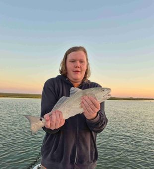Rockport fishing charter action—hooked up on Texas speckled trout.