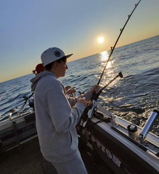Perfect sunset fishing session using deep sea trolling with heavy tackle. Clear conditions made for an exciting adventure on the water.