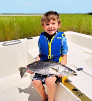 Talk about a picture-perfect moment! Check out the smile on 6-year-old Dylan as he shows off his impressive 24-inch speckled trout. Ready to capture your own family fish tales in the Golden Isles? Join Kennedy Fishing Legacy for an unforgettable day of tight lines and big smiles!