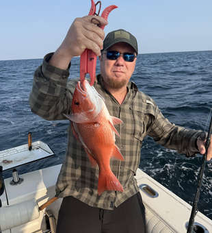 Reeling in the red gold: Deep sea jigging pays off in Niceville!