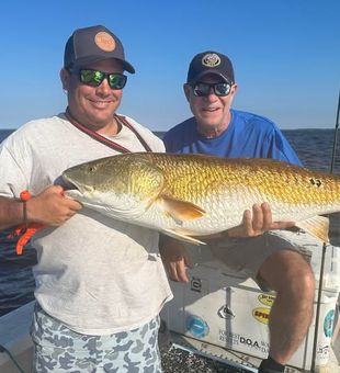 Inshore fishing in Eastern North Carolina—target redfish, speckled trout, and flounder in productive coastal waters.