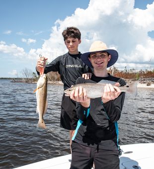 Young Anglers and young Red fish reeled in! - Fort Myers, FL.