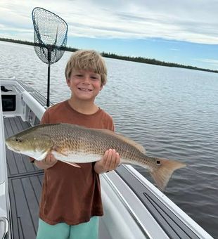 Red fish and a young angler  - Fort Myers, FL.
