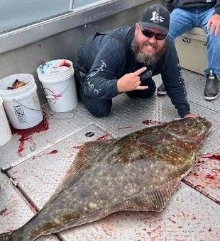 Reeling in this gigantic Halibut was a win!