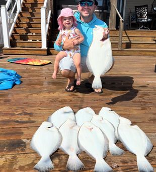 "Flounder haul success! A perfect day on the dock with my little fishing buddy ��— 10 flounder and unforgettable memories!"