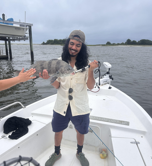 Reeling in a Black Drum on a stormy Wilmington day!