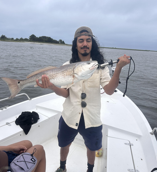 Big redfish reeled in on a partly cloudy day!