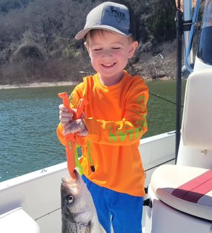 Grinning with a hefty Striper!