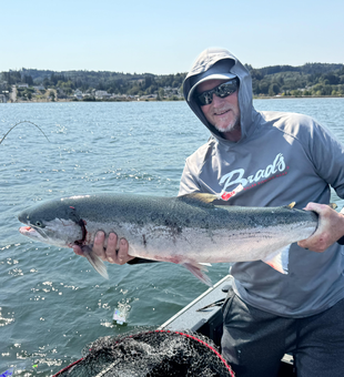 Huge Coho Salmon reeled in on a partly cloudy day!