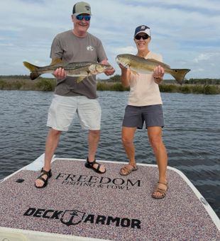 Happy redfish catch Spring Hill FL fishing charters