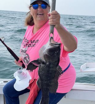 Proud catch of a solid Black Sea Bass!