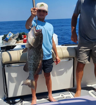 Proud young angler! Gag Grouper catch, Carrabelle family fishing charter