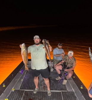 Aiming for redfish under the stars in Lafitte, Louisiana
