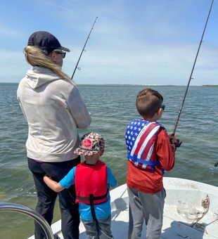 Fun family fishing trip casting lines in coastal bay
