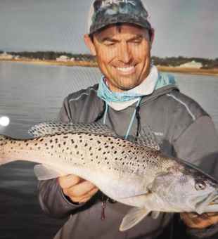 Nice speckled trout on an exciting fishing adventure despite the cloudy weather!