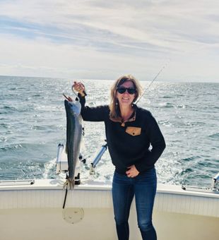 Reeling in King salmon on Lake Ontario during peak salmon season.