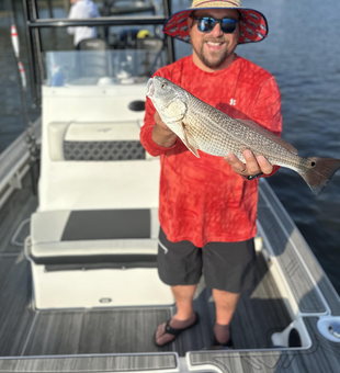 Storms brewing, but the redfish are biting at 124 Palmetto Dr!