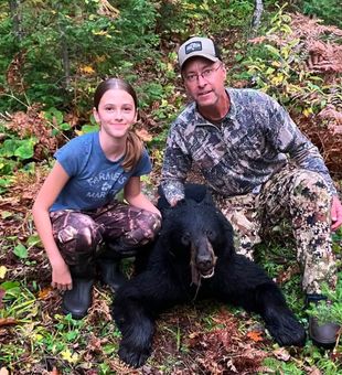 Successful bear harvest in the beautiful Finland MN wilderness!