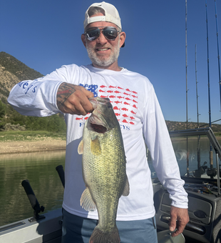 Jigging for Largemouth Bass in Silt's crystal-clear waters!