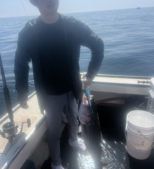 Tackling the waves with an array of fishing techniques on a partly cloudy day.