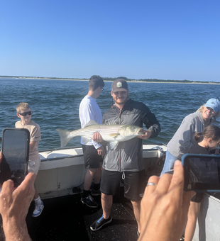 Big Striped Bass reeled in during an epic Deep Sea adventure!