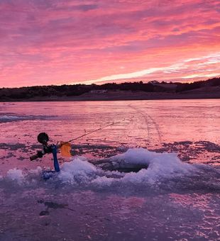 Vibrant Ice Fishing Sunrise