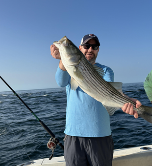 Striped bass action in Yarmouth: deep sea jigging and trolling under clear skies!
