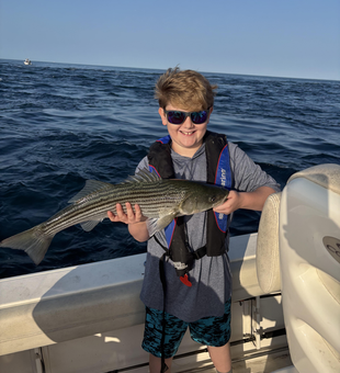 Striped bass action in Yarmouth: where deep sea jigging meets clear skies!