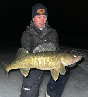 Bold ice fishing Walleye catch at night