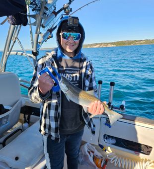 Reel in King Salmon and Lake Trout on a guided fishing trip in Port Washington, Wisconsin, with breathtaking views of Lake Michigan all around.
