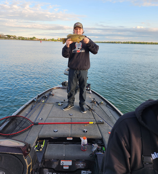 Drifting through the rainy day in search of the best fishing spots.