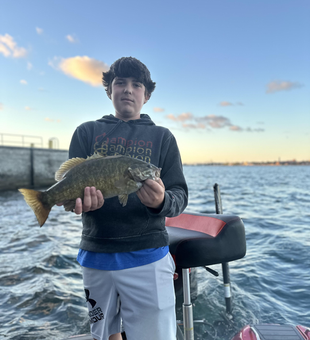 Nice smallmouth bass using drift fishing technique in partly cloudy conditions!