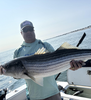 Deep sea action with striped bass at The Waterfront Club!