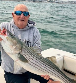 Classic striper fishing in Scituate, Massachusetts with steady bites in Massachusetts Bay.