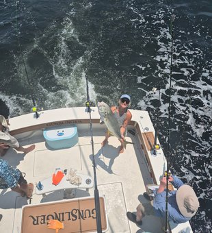 A massive Crevalle Jack caught using a variety of techniques in the clear waters of Biloxi, Mississippi.