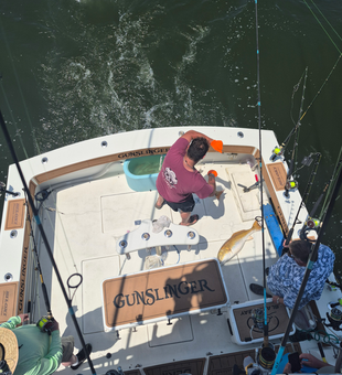 Hauling in another catch on the high seas.