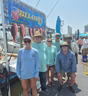 Reeled in a feisty red snapper during an epic fishing adventure in Biloxi!