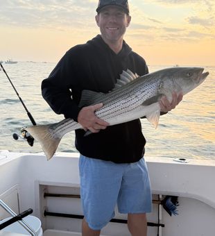 Strong striped bass catch Boston fishing charter