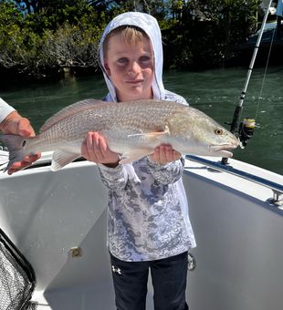 Proud young angler with a beautiful Redfish!