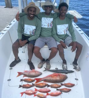 Colorful snapper haul with this happy crew!