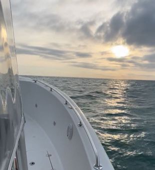 Peaceful sunrise cruise on open water.