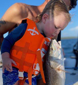 No one is too young for fishing! Got this Trout!