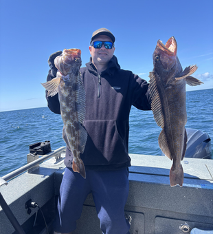 Double trouble: Two huge lingcod hooked in Newport's clearing skies!